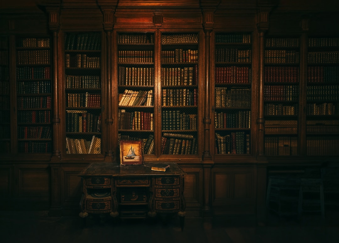 Dark wood library bookcase with antique volumes